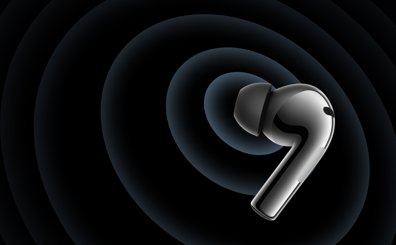 Sleek silver earbuds against abstract dark background.