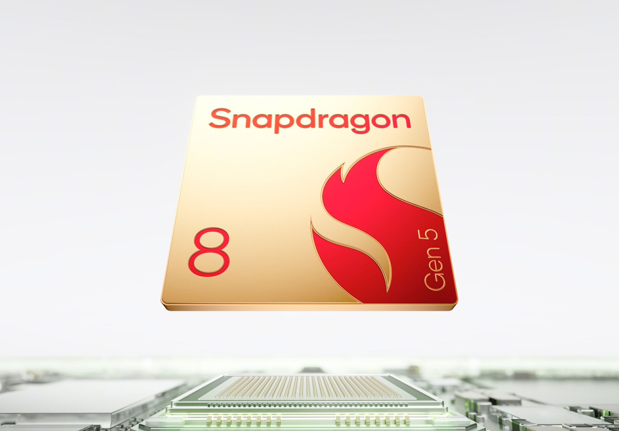 Rectangular gold and red Snapdragon Gen 5 microprocessor chip on circuit board.